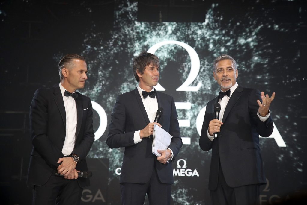 LONDON, ENGLAND - APRIL 26: (L-R) Omega President and CEO Raynald Aeschlimann, Prof. Brian Cox and George Clooney on stage at the OMEGA 'Lost In Space' dinner to celebrate the 60th anniversary of the OMEGA Speedmaster, which has been worn by every piloted NASA mission since 1965, at Tate Modern on April 26, 2017 in London, England. (Photo by Mike Marsland/Mike Marsland/Getty Images for OMEGA) *** Local Caption *** Raynald Aeschlimann; Brian Cox; George Clooney